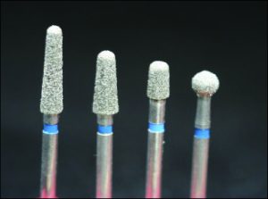 Figure 10-34. Different types of burs such as tapered cylinder and round can be used in the preparation of the occlusal rest seats.